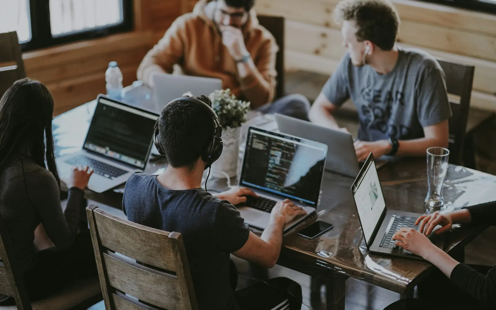 People collaborating around a laptop in the office
