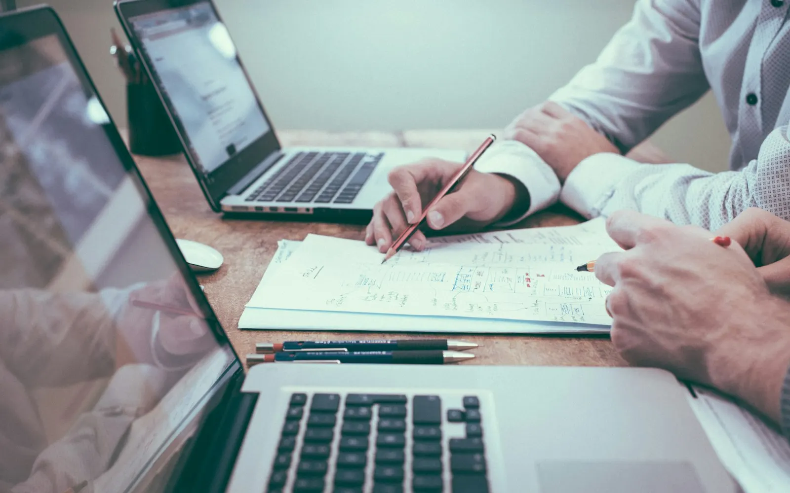 Financial planning with documents and a laptop